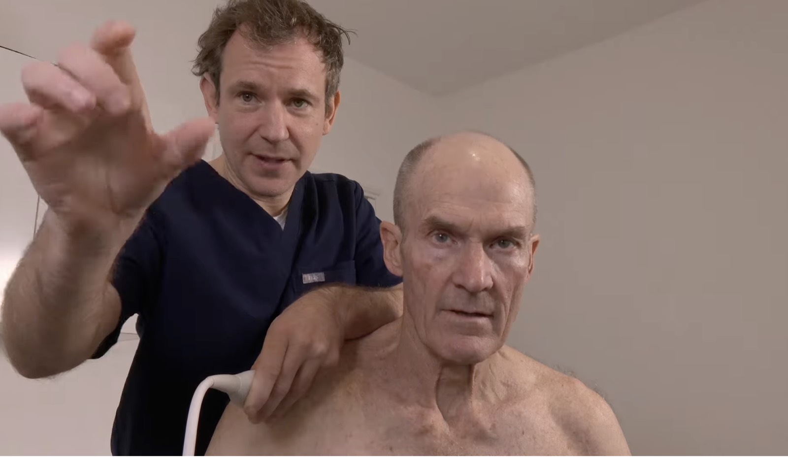 A clinician scanning a patient’s shoulder with ultrasound