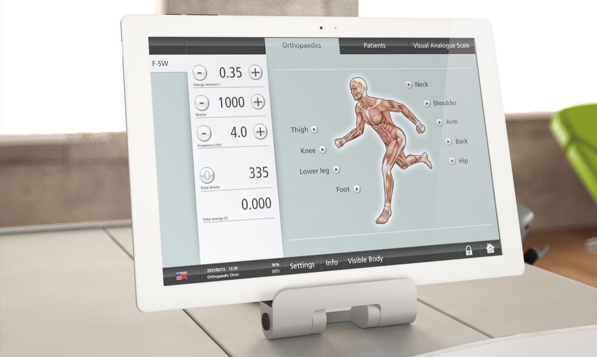 The shockwave system’s control screen showing energy, number of pulses and frequency settings