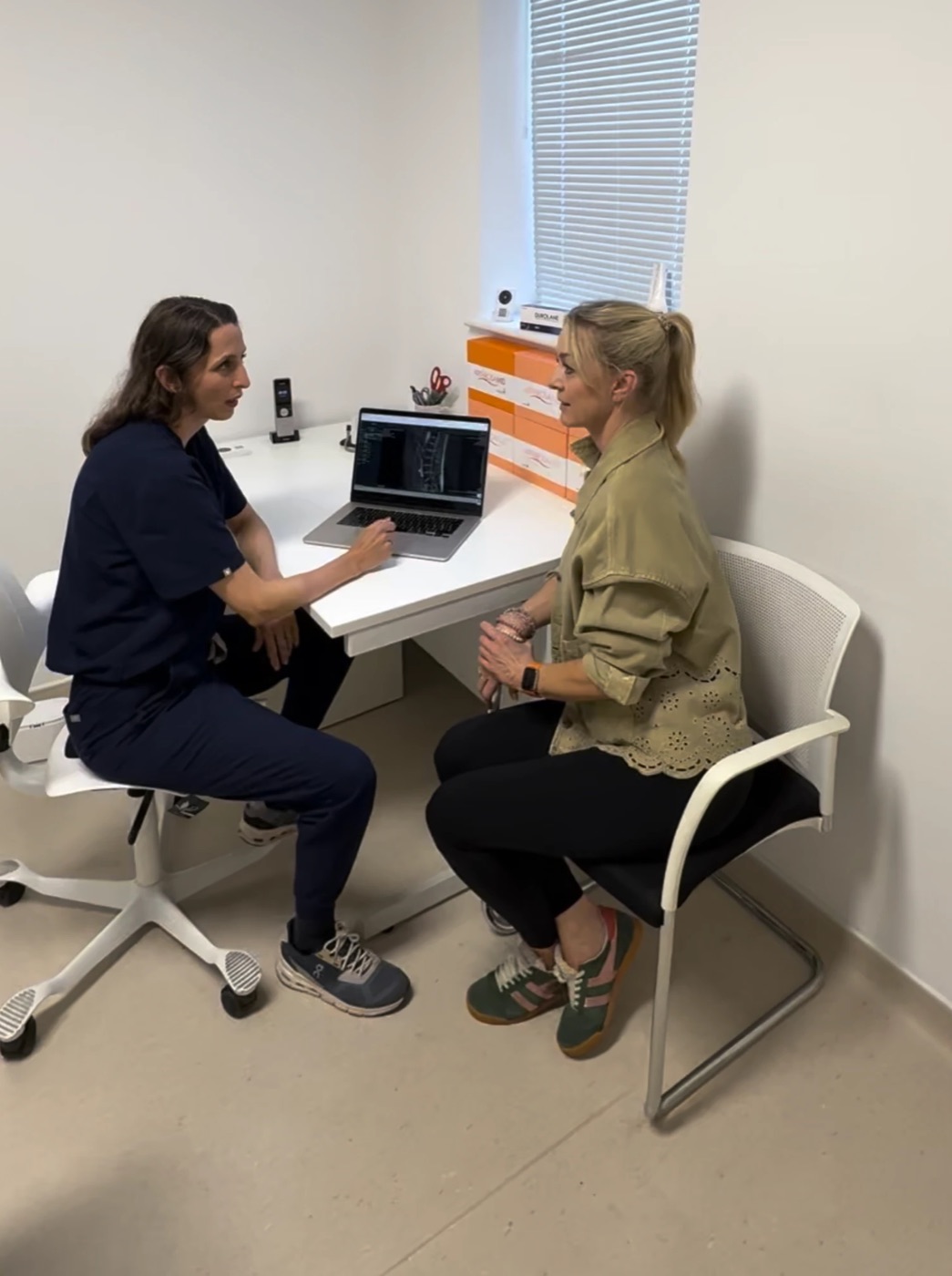 A clinician at Vale talking with a patient during a consultation